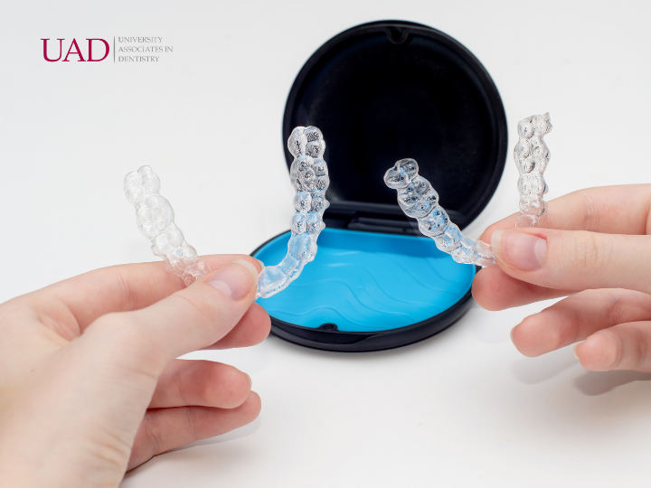 Week-by-week set of dated clear aligner trays, the at-home routine behind Invisalign® vs. braces for adults, Invisalign® vs. Braces for Adults, University Associates in Dentistry