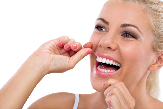 Young woman flossing her teeth