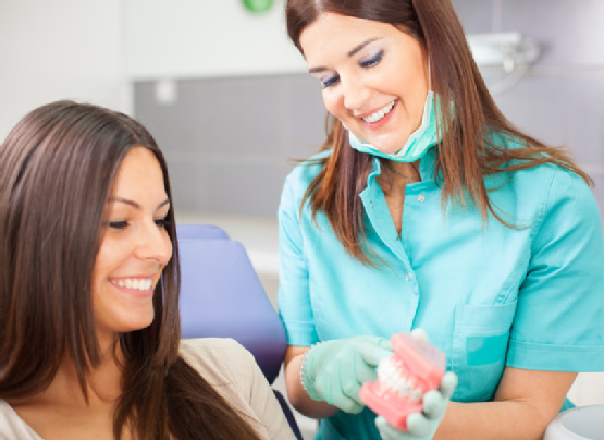 Young woman patient and dentist